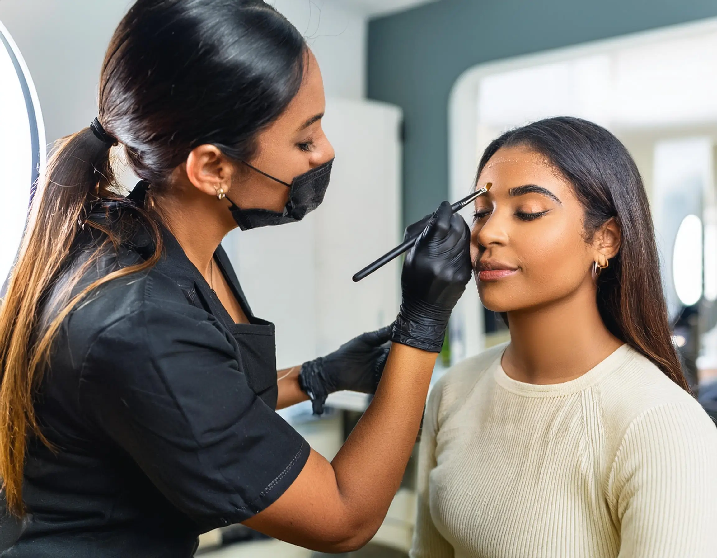 What happens if i get my powder brows wet - Firefly A professional technician performing the powder brow procedure in a clean and modern studio 1